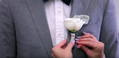 Pinning on a Boutonniere