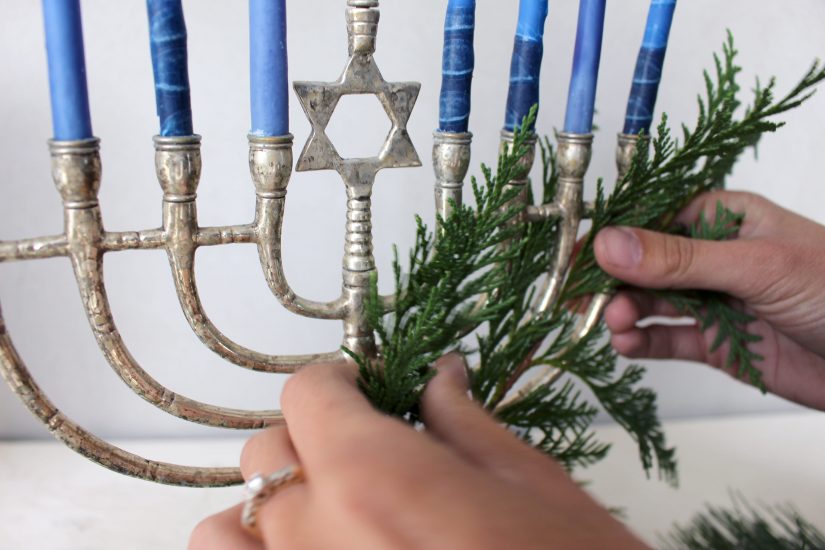 Weave greenery through your menorah Weave greenery through your menorah