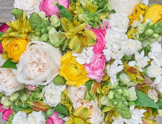 Top-down view of a bouquet with ranunculus included.