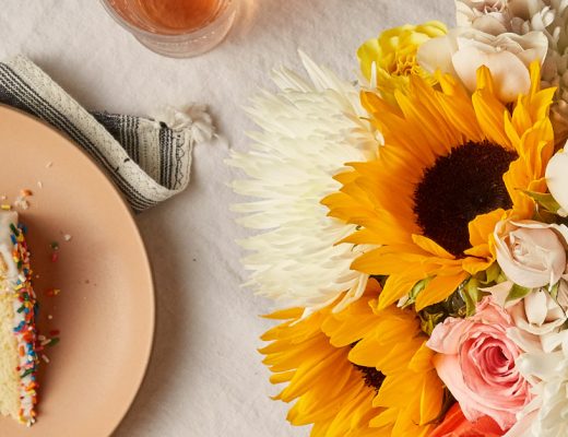 Top-down view of various flowers on a table.