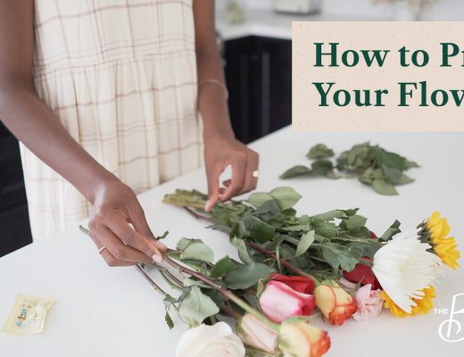 Woman unpacking and processing flowers on a kitchen table