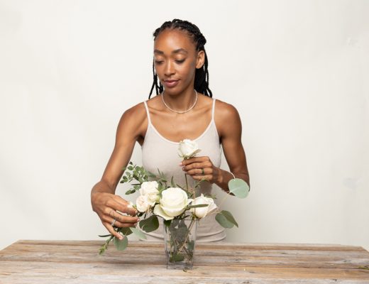 Young woman arranging flowers