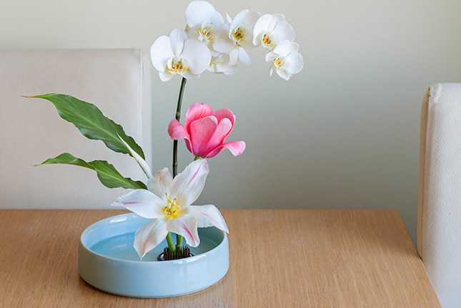 Upright moribana arrangement with white and pink flowers