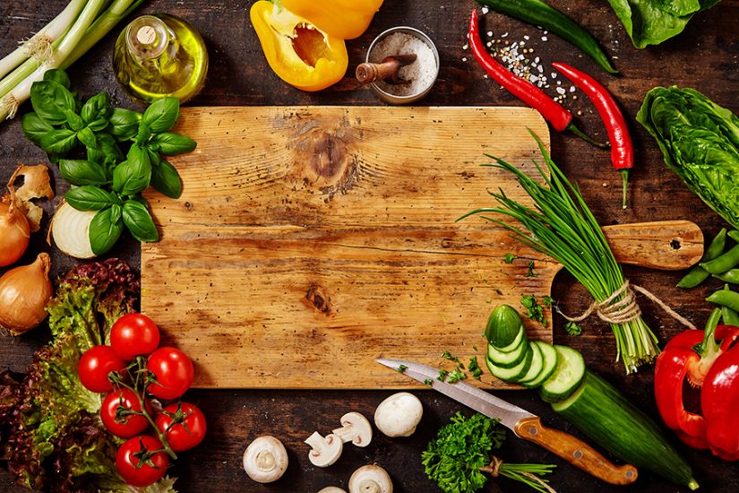 high-quality cutting board surrounded by vegetables