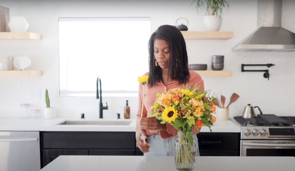 Kaylyn Hewitt Arranging Sunflower Bouquet