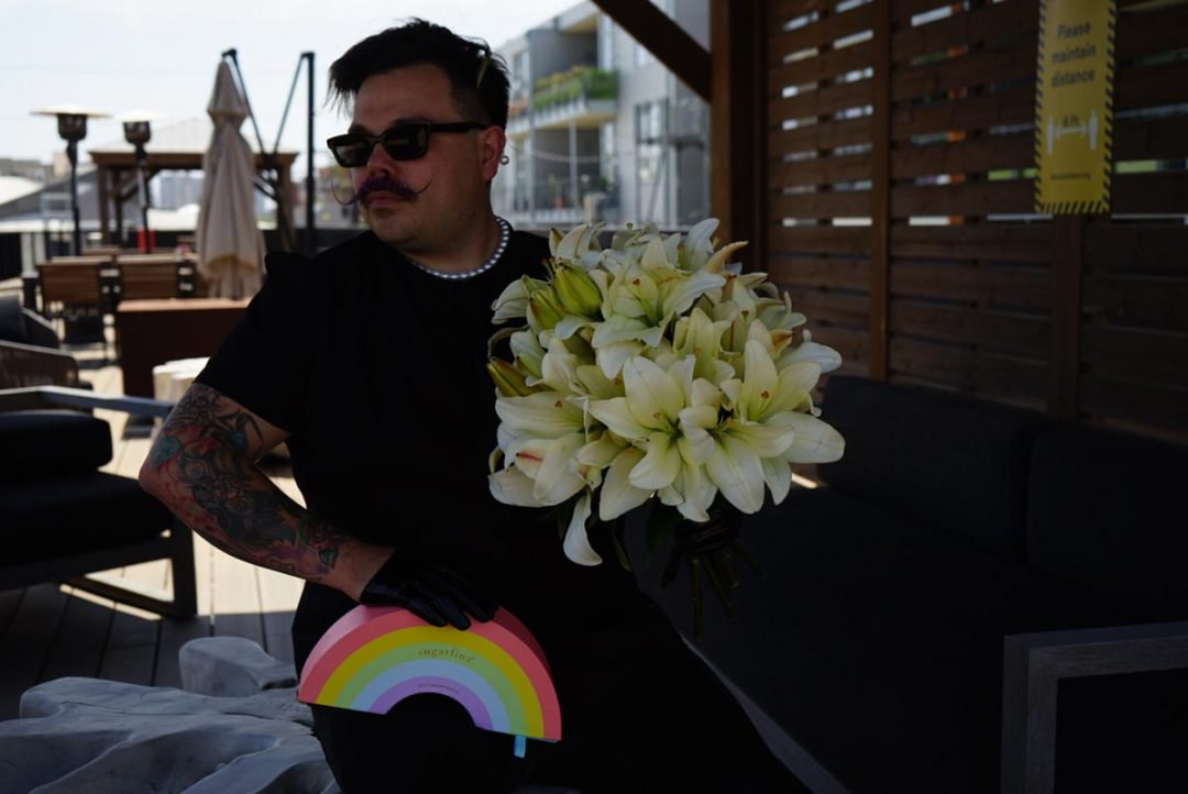 Pride bundle with white lilies and Sugarfina rainbow box