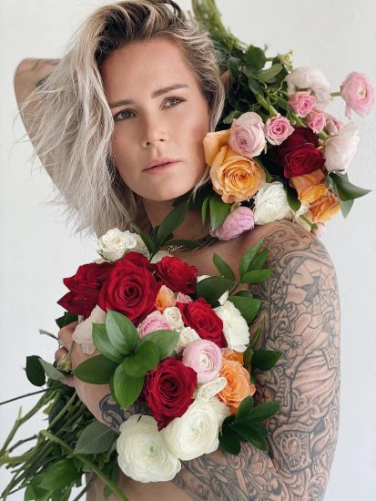 Ashlyn Harris with Ladies Night Pride bouquet