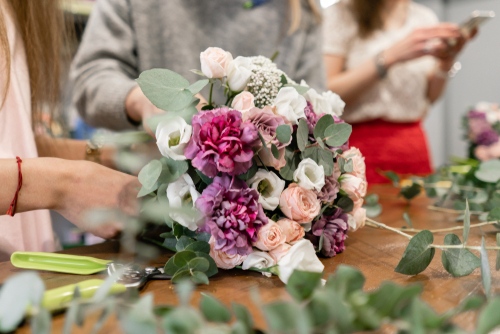 Deconstructing a bouquet of flowers to make a floral crown