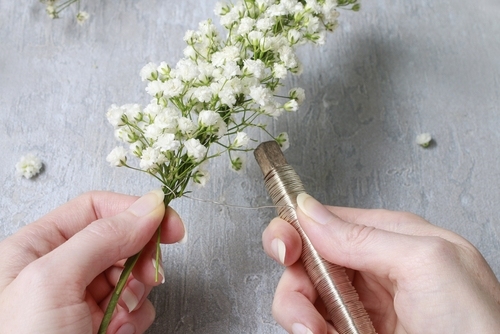 Applying floral wire to a stem