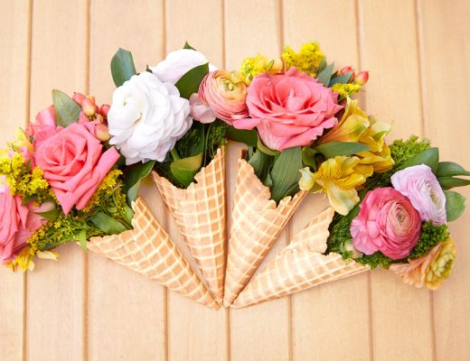 Flower bouquet displayed in waffle cones for friends