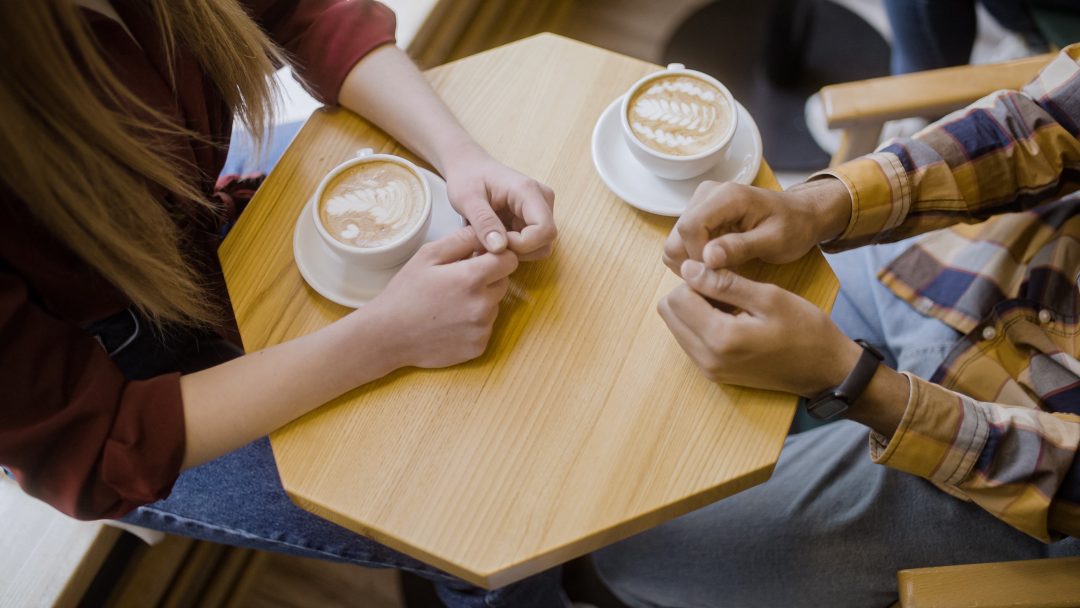 Man and woman on date at coffee shop