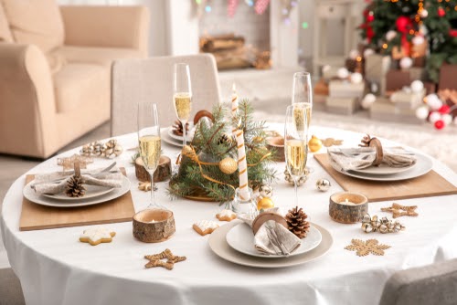 Table setting with pine golds and gold accentsfor Christmas dinner