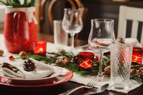 Table setting for celebration Christmas and New Year Holidays. Festive table at home with rustic details