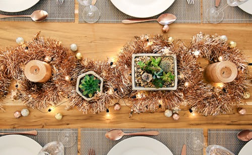 Metallic Holiday rustic table setting with succulents from above