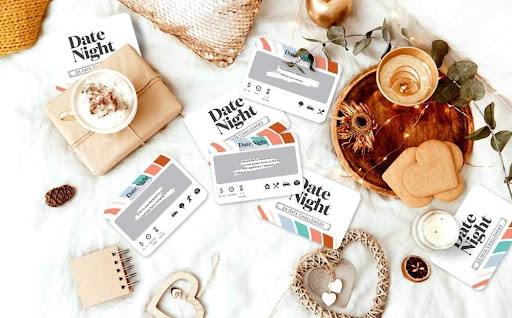 date night idea cards with cookies, candle, heart-shaped crafts