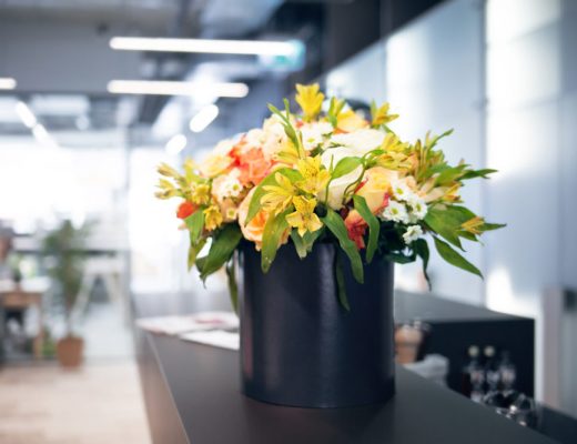 yellow and white flower arrangement in an office
