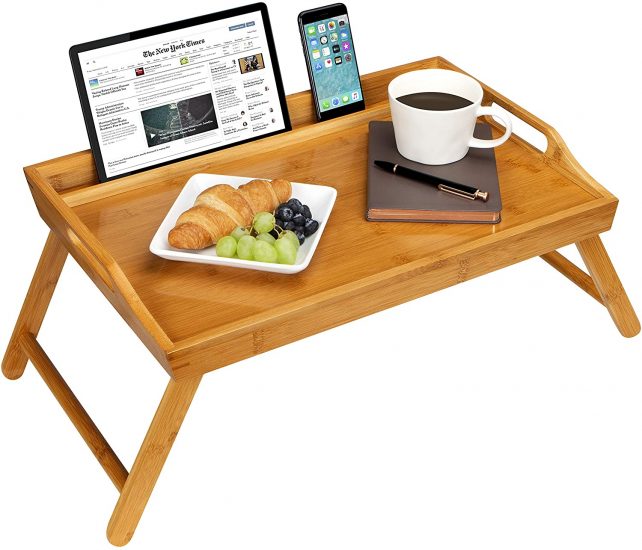 tray table sized for breakfast in bed with a plate of snacks, coffee and a holder for smart phone and tablet
