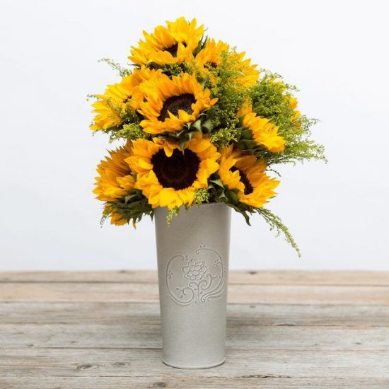 Sunflower bouquet in a white vase