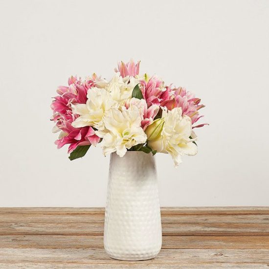 Pink and White Rose Lilies in a white vase