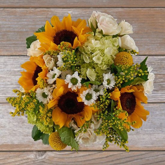 Sunflower bouquet with white spray roses and chamomile