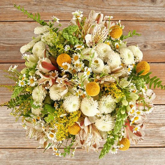 Bouquet with chrysanthemums, feverfew, alstroemeria, snapdragons in yellow, white and green