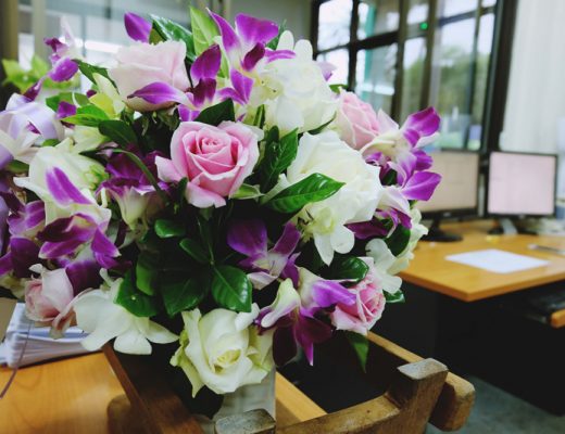 workplace with bright fresh flowers