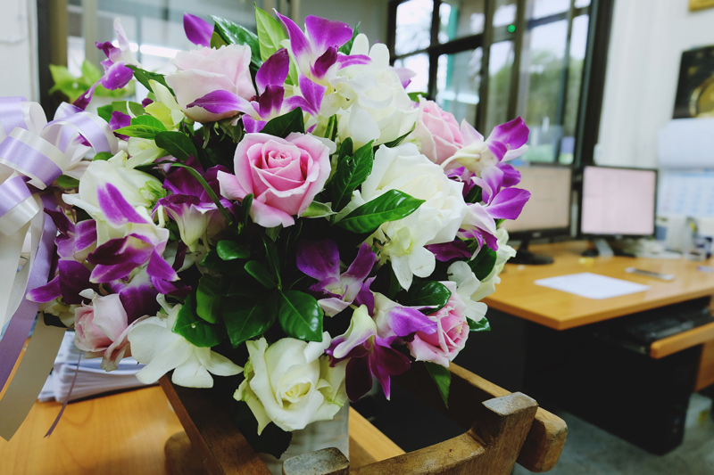 workplace with bright fresh flowers
