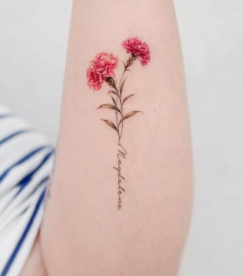 tatoo of 2 pink carnations on a person's forearm