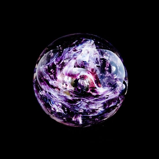round swirly purple paperweight