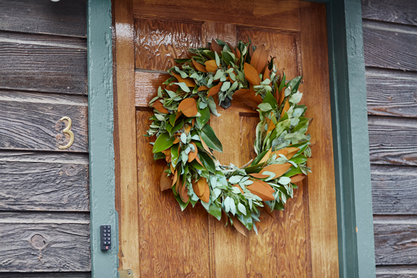 holiday eucalyptus and magnolia wreath on the front door