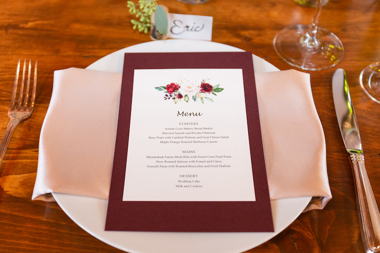 wedding menu on table setting with utensils on the side