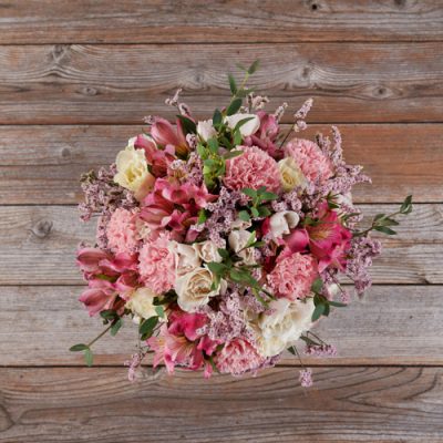 peach carnations and limonium with white spray roses