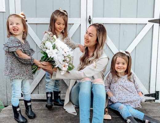 mom sharing flowers with happy kids