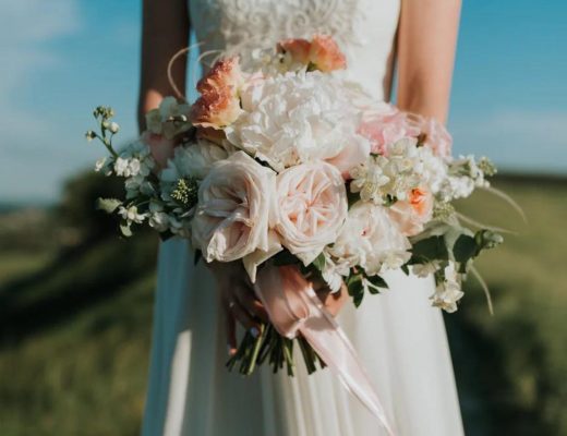 Bride holding a wedding bouquet of flowers