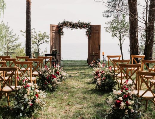 Small outdoor wedding venue with 20 chairs and an archway