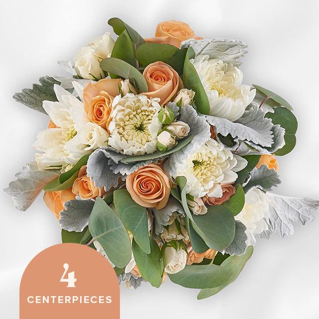4 centerpieces with peach and ivory floral blooms.