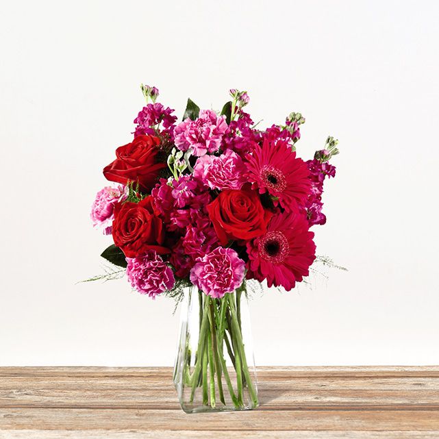 Elegant floral display in red and pink.