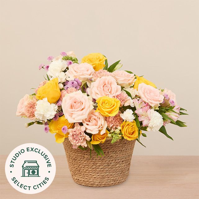 mixed floral arrangement in yellow, white, pink and other pastel colors