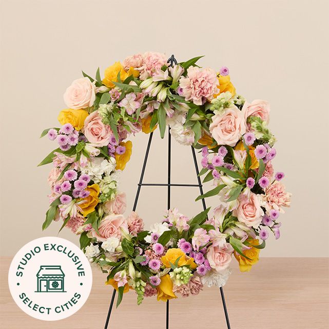 mixed floral wreath in yellow, white, pink and other pastel colors