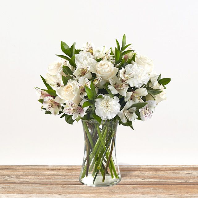 Mixed floral arrangement in white.